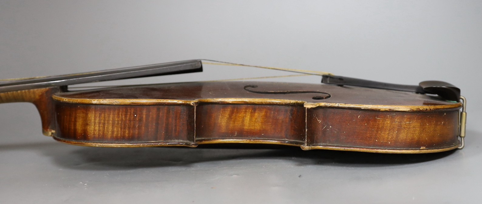A cased German violin, labelled Stradivarius and dated 1886, back measures 36cm excl button